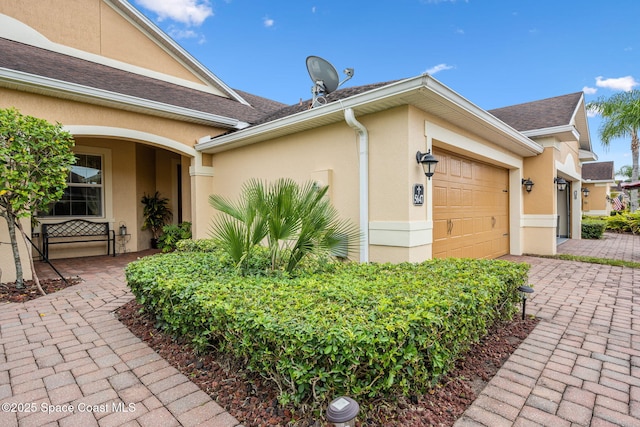 entrance to property featuring a garage