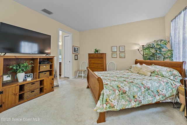 bedroom featuring light colored carpet