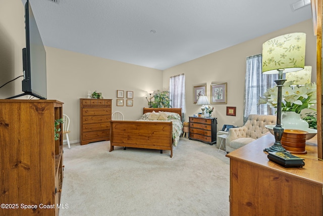 bedroom with light carpet