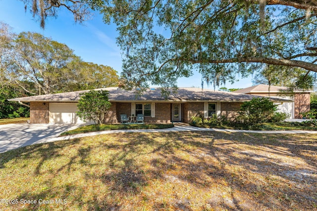 single story home with a garage and a front yard