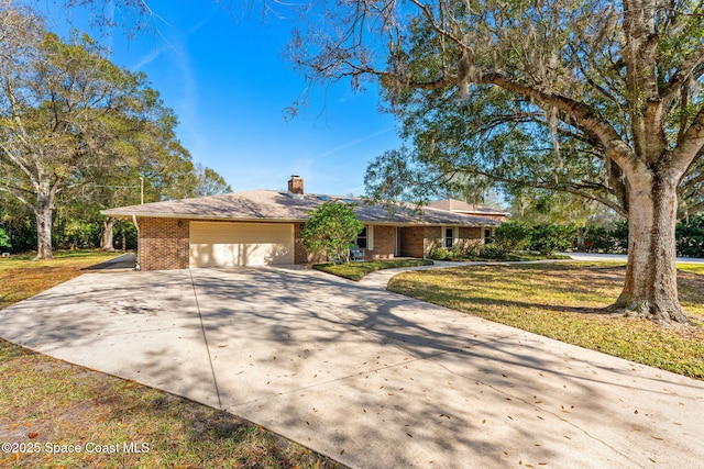 single story home with a garage and a front yard