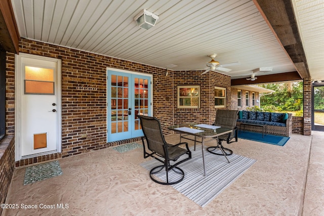 view of patio / terrace with an outdoor hangout area, french doors, and ceiling fan