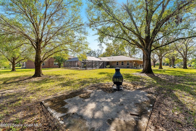 view of yard with a lanai