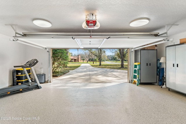 garage featuring a garage door opener