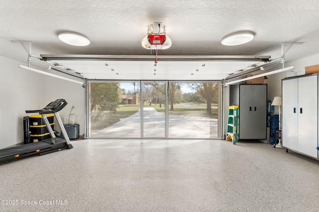 garage featuring a garage door opener