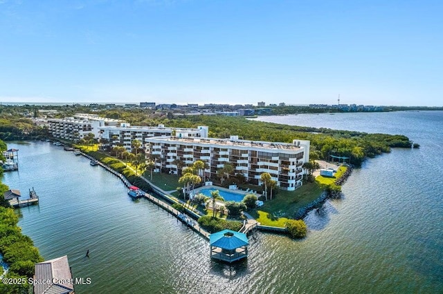 birds eye view of property with a water view