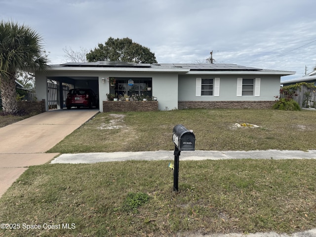 ranch-style home with a front lawn and a carport