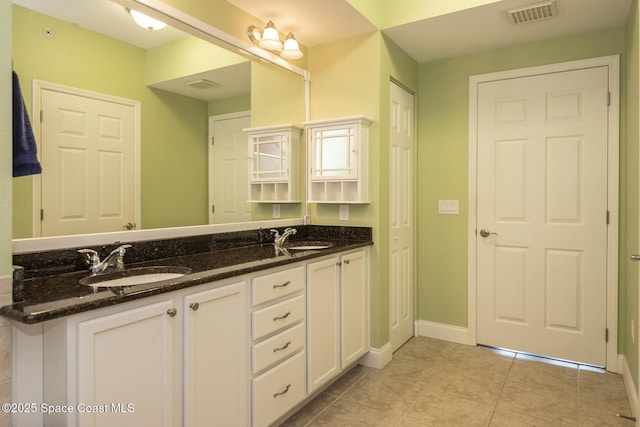 bathroom featuring tile patterned floors and vanity