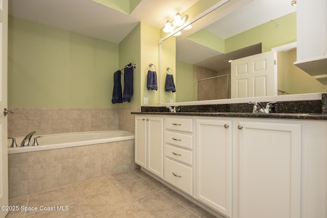 bathroom with tile patterned flooring, vanity, and shower with separate bathtub