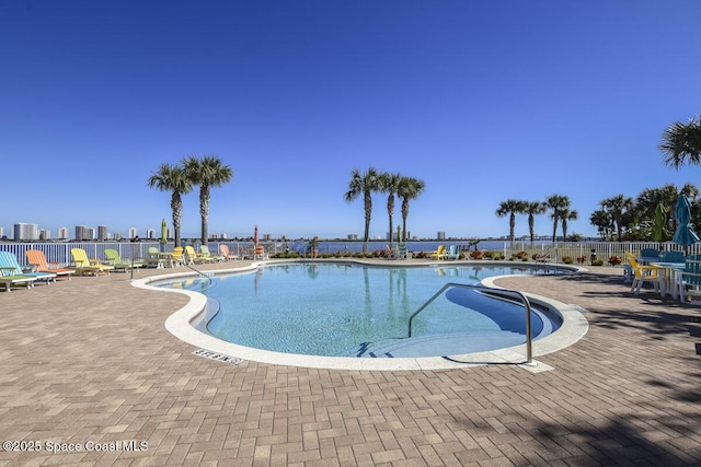 view of swimming pool with a patio and a jacuzzi