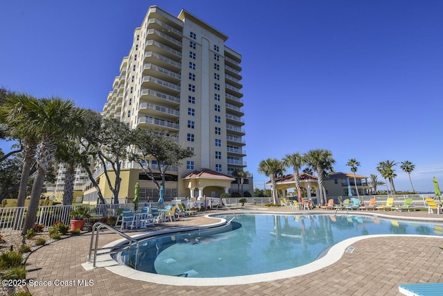 view of swimming pool with a patio