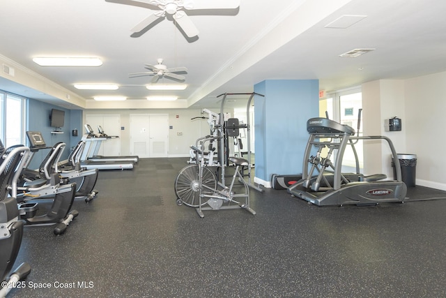 gym with ornamental molding and ceiling fan