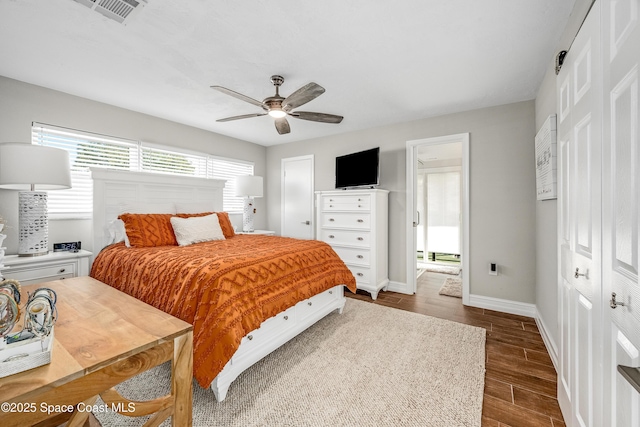 bedroom featuring ceiling fan and a closet