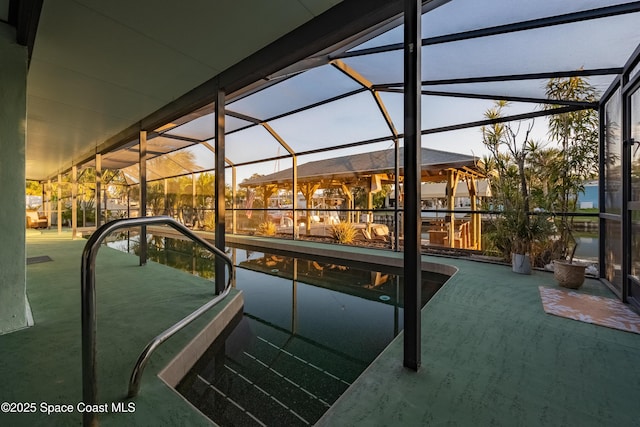 view of pool with a lanai and a patio area