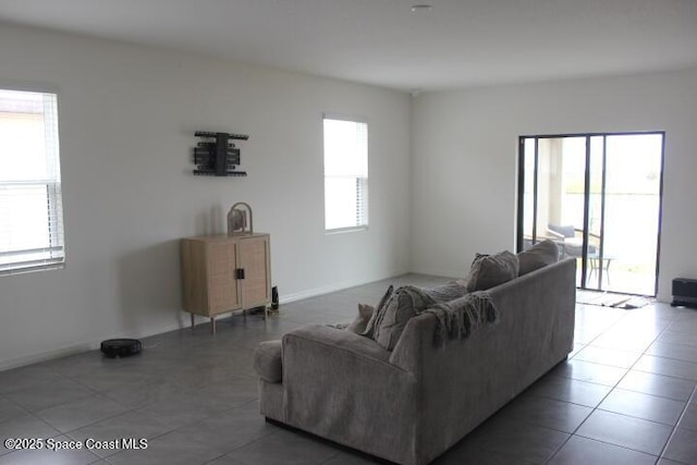 tiled living room with a wealth of natural light