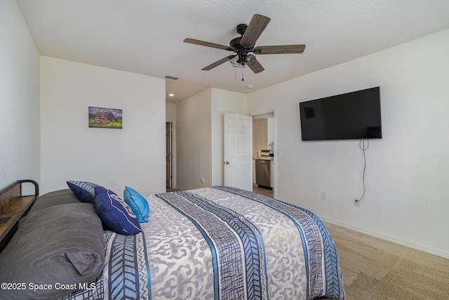 carpeted bedroom with a ceiling fan, visible vents, and baseboards