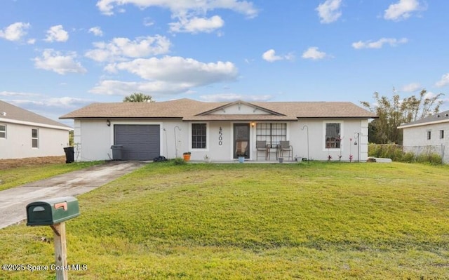 ranch-style home with a garage and a front lawn