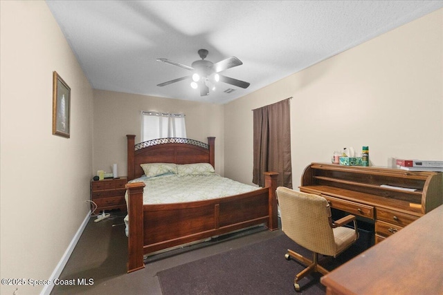 bedroom featuring ceiling fan and a textured ceiling