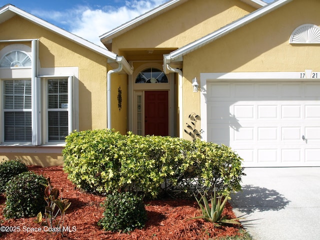 entrance to property featuring a garage