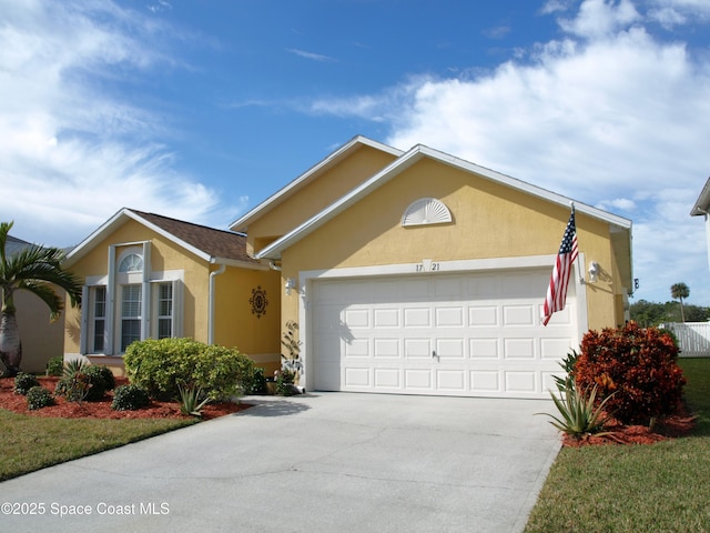 single story home featuring a garage