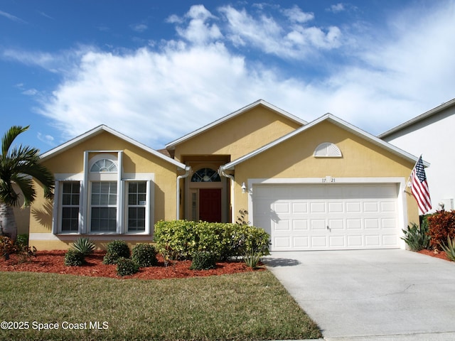 single story home featuring a garage and a front lawn