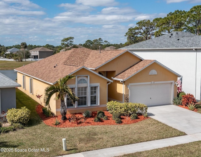 ranch-style home with a garage and a front yard