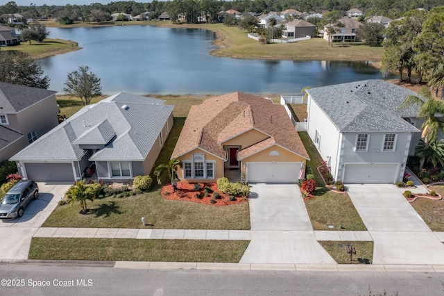 drone / aerial view with a water view