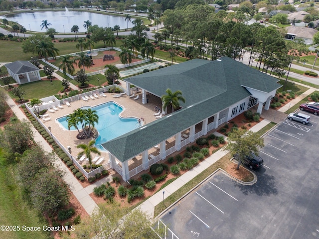 birds eye view of property featuring a water view