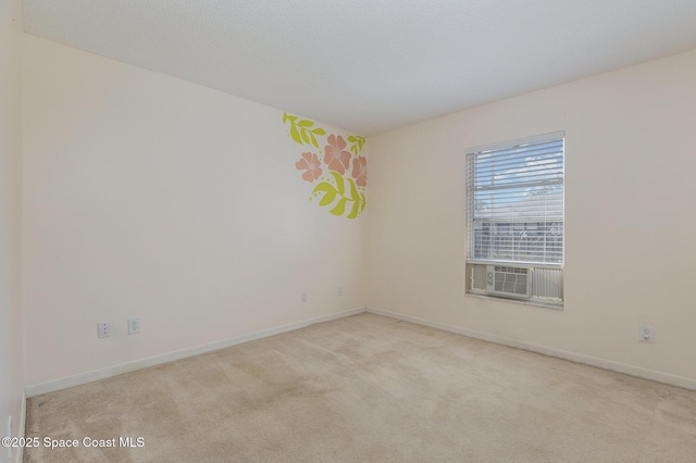 carpeted empty room featuring cooling unit