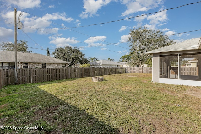 view of yard with a sunroom