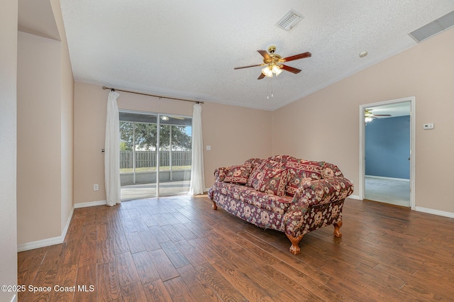 sitting room featuring vaulted ceiling, ceiling fan, a textured ceiling, and dark hardwood / wood-style floors