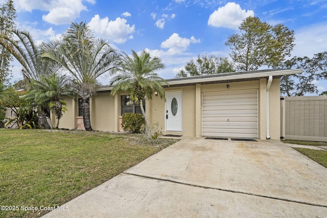 view of front facade with a garage and a front yard