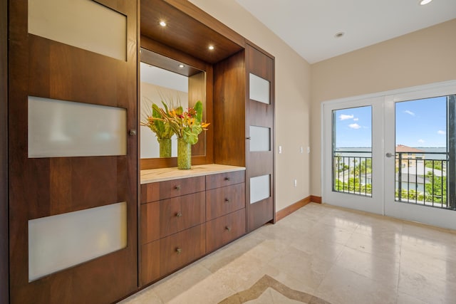 bedroom with access to exterior and french doors