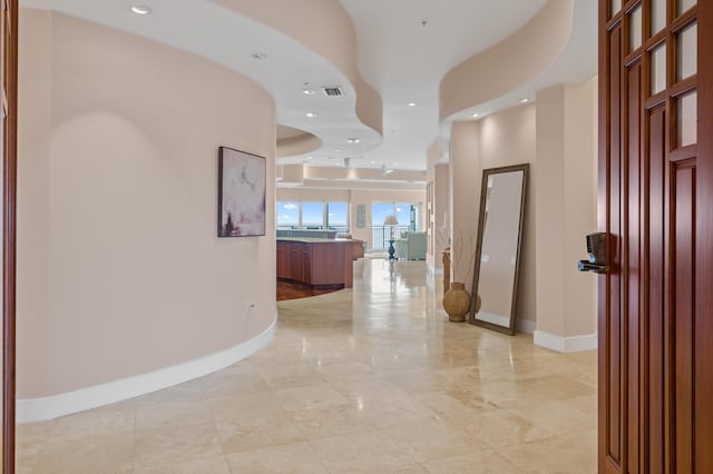 corridor with a tray ceiling