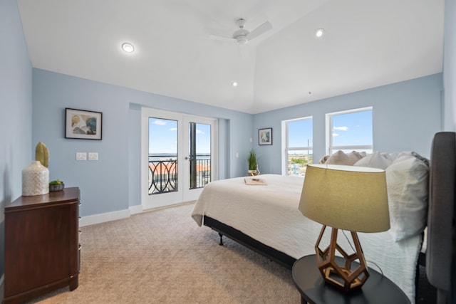 carpeted bedroom featuring ceiling fan, lofted ceiling, access to outside, and french doors