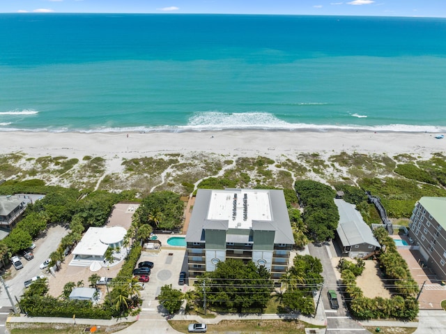 bird's eye view with a view of the beach and a water view