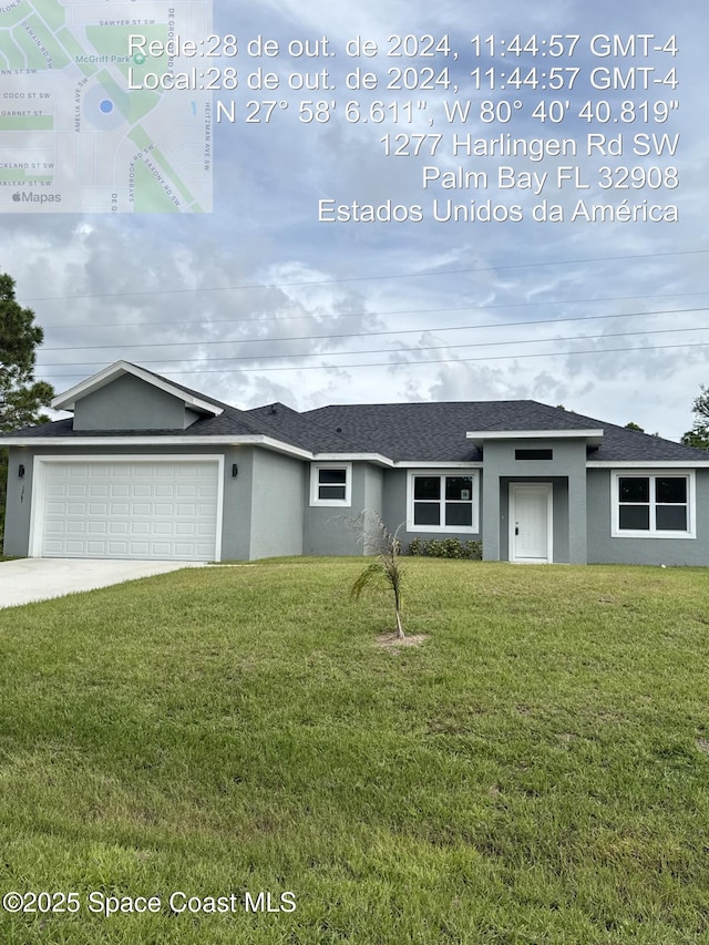 ranch-style house with a front yard and a garage