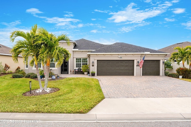 view of front of house with a garage and a front yard