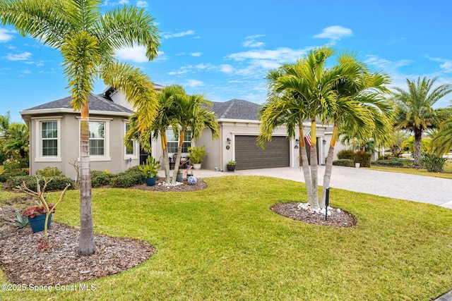 view of front facade featuring a garage and a front yard