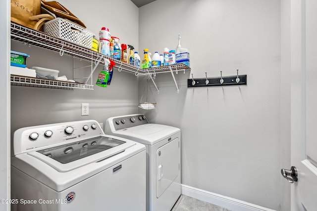 laundry room with independent washer and dryer