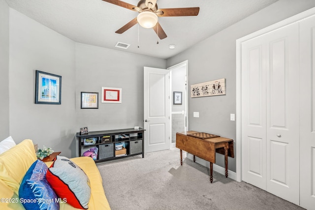 interior space with ceiling fan