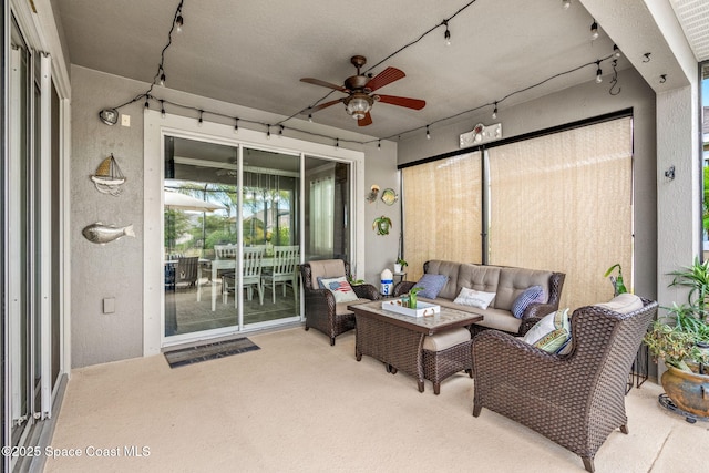 view of patio / terrace with an outdoor living space and ceiling fan