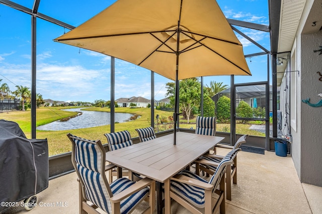 sunroom / solarium with a water view