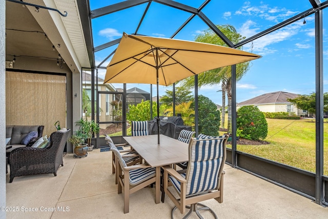 view of patio with glass enclosure