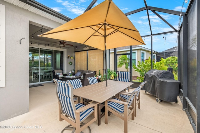 view of patio with grilling area, a lanai, and ceiling fan