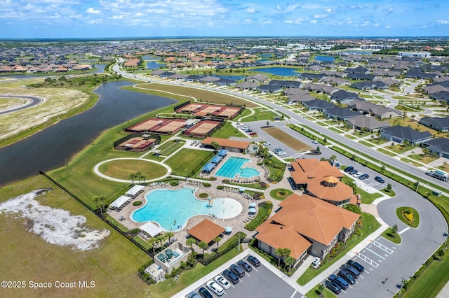 birds eye view of property featuring a water view