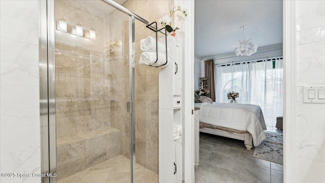 bathroom with an enclosed shower and crown molding