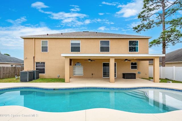 view of pool with ceiling fan, cooling unit, and a patio