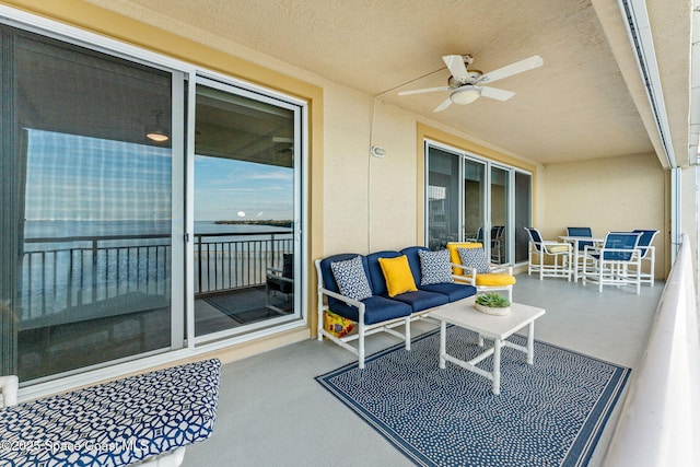 view of patio / terrace with an outdoor living space and ceiling fan