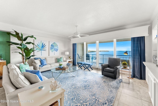 tiled living room with crown molding, a water view, ceiling fan, and a textured ceiling